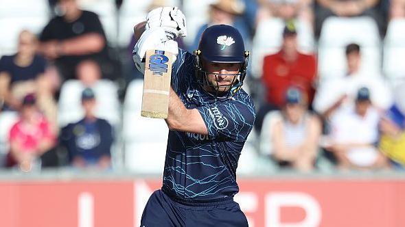 Yorkshire's Adam Lyth, batting in all navy, plays a shot