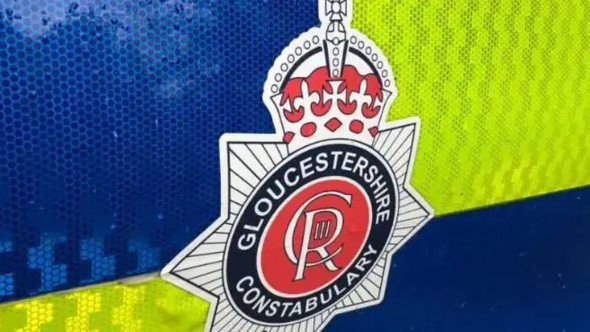 A Gloucestershire Police car with a logo on the side