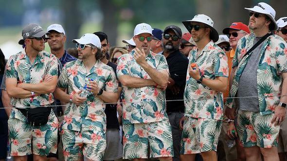 Fans dressed in matching Hawaiian shirts and shorts watch the action during the second round of the 2022 PGA Championship at Southern Hills Country Club on May 20, 2022 in Tulsa, Oklahoma