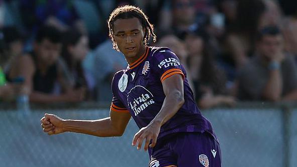 Kaelan Majekodunmi kicks the ball during a match for Perth Glory