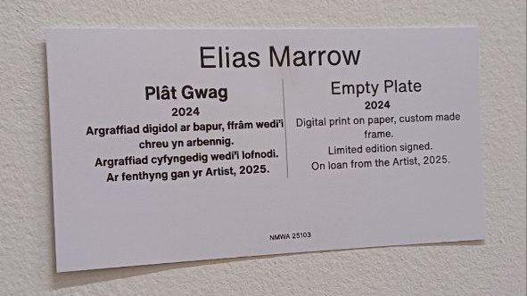 A close up of the label which says Elias Marrow Empty Plate 2024 inWelsh and in English