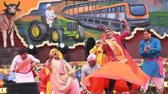 Folk artists performing during Bihar Diwas 2026 function at Gandhi Maidan on March 22, 2026 in Patna, India.