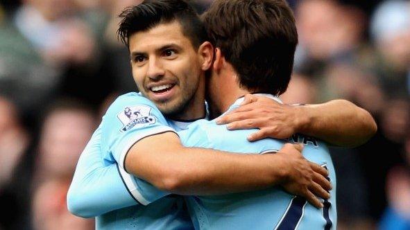 Sergio Aguero (left) congratulates David Silva after scoring Manchester City's second goal