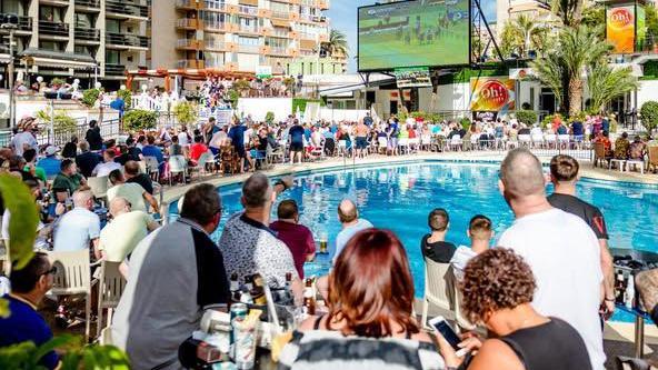 Holidaymakers watching Cheltenham at the Marina Resort Benidorm