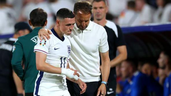 Gareth Southgate, with Phil Foden against Slovenia, has always protected his players before himself