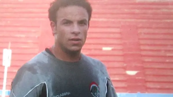 Fahd is wearing a grey football top in this old photo from Syria