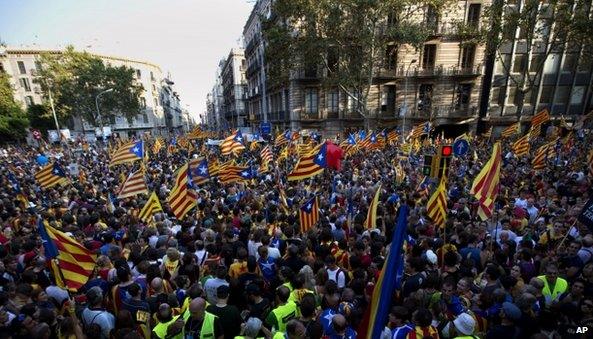 Demonstrators wave Catalan flags during a protest rally in Barcelona , Spain, 11 Sept 2012