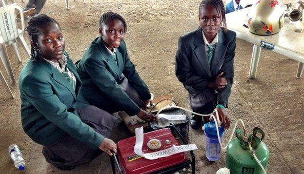 School girls show off their urine-powered generator, copyright Erik Hersman