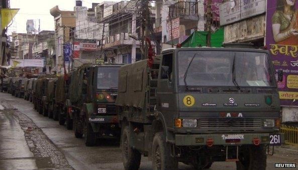 Indian army vehicles patrol on a deserted road during a curfew in Muzaffarnagar, in the northern Indian state of Uttar Pradesh September 8, 2013