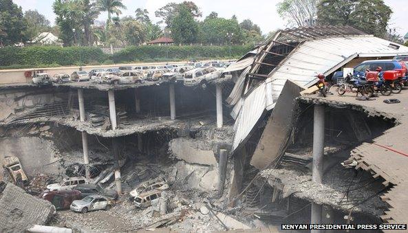 The remains of cars and other debris can be seen in a general view photographed from the rooftop, of the parking lot outside the Westgate Mall