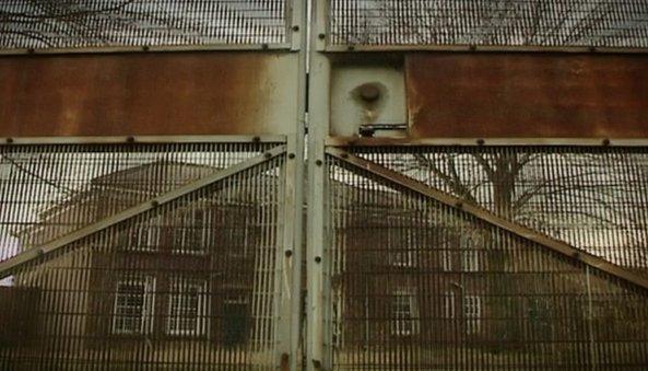 Rusty gates shut in front of the closes detention centre at Medomsley