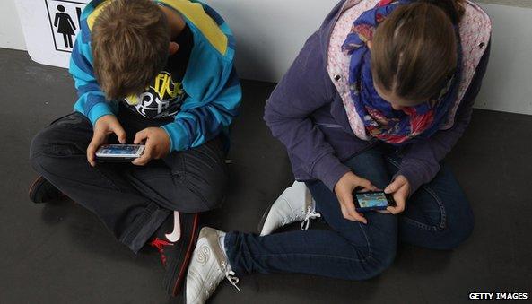 Children using mobile phones