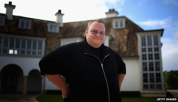 Kim Dotcom outside his mansion