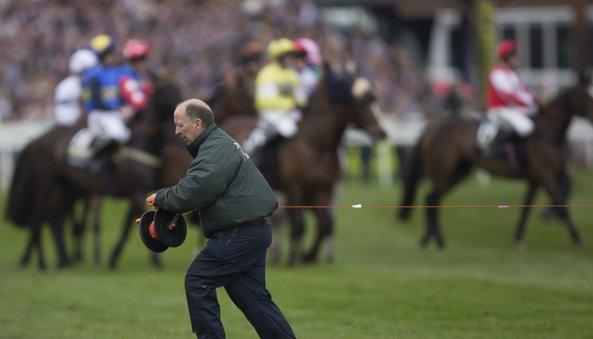 Starting tape is stretched across the course after a false start to the Grand National