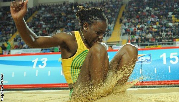 Jamaica's Kimberley Williams lands in the sand during the women's triple jump final at the 2012 IAAF World Indoor Athletics Championships at the Atakoy Athletics Arena in Istanbul