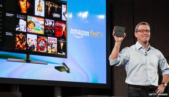 Amazon TV screen with man holding device