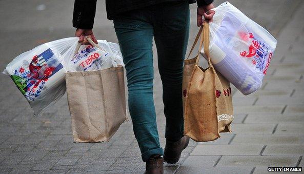 Man with Tesco shopping bags