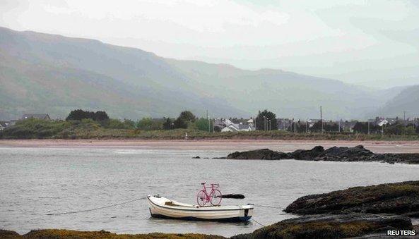 A pink bicycle was strapped to a fishing boat near the village of Cushendall