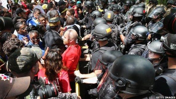 Protestors being met by police officers