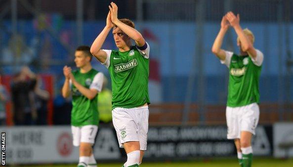 Hibs captain Liam Craig (centre) and team-mates applaud the visiting fans