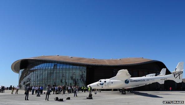 WhiteKnightTwo, carrying SpaceShipTwo, sits on display outside the hangar facility at Spaceport America, northeast of Truth Or Consequences, on October 17, 2011 in New Mexico