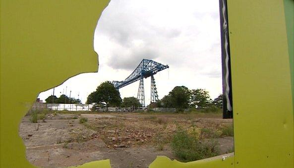 Middlesbrough's Transporter Bridge in front of a derelict plot of land