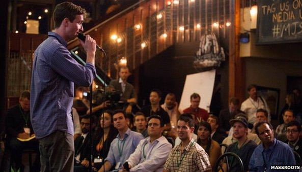 Man pitching crowd at Marijuana start up