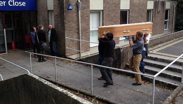 Campaigners carry coffin with objection letters