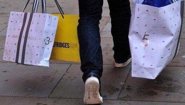 A man carrying bags of shopping