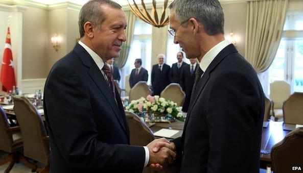 Turkish President Recep Tayyip Erdogan and Jens Stoltenberg shake hands during meeting in Ankara, Turkey, 10 October 2014