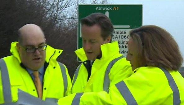 Prime minister David Cameron, centre, with Highways Agency staff in Northumberland