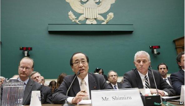 Hiroshi Shimizu, senior vice president of global quality assurance at Takata, center, joined by Rick Schostek, executive vice president of Honda North America, right, testifies on Capitol Hill in Washington, Wednesday, Dec. 3, 2014,