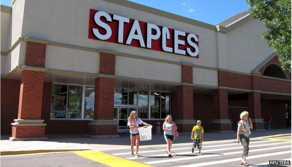 Staples store with family out front