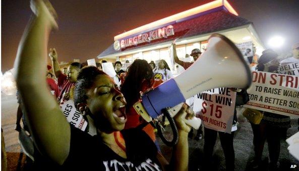 Workers protest in front of Burger King