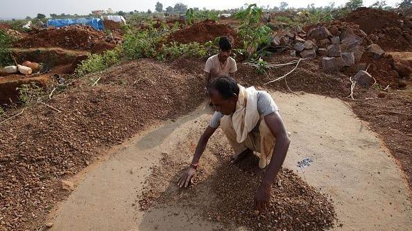 A miner sifting through gravel in Madhya Pradesh's Panna district