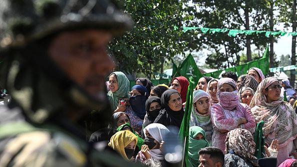 An army personnel stands guard at a PDP rally 