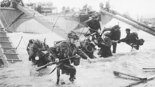 soldiers wading through water