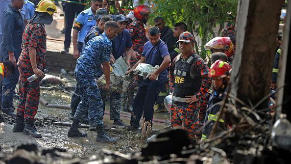 Rescue workers removed rubble and debris from the crash site