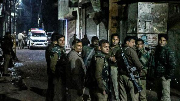 Armed police personnel stand guard following religious violence near the Shahi Jama Masjid in Sambhal on November 24, 2024