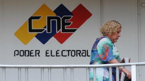 A woman walks at the National Electoral Center in Caracas on 22 August, 2012