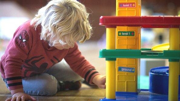 A young boy plays with toys at a playgroup for pre-school aged children in 2015.