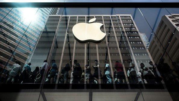 Customers queue inside an Apple store in Hong Kong