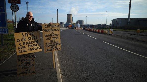 Lone demonstrator Neil Dawson protests in support of the UK steel industry outside the Tata Steel processing plant at Scunthorpe,