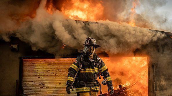 Firefighter tackling a blaze in Los Angeles wildfires.