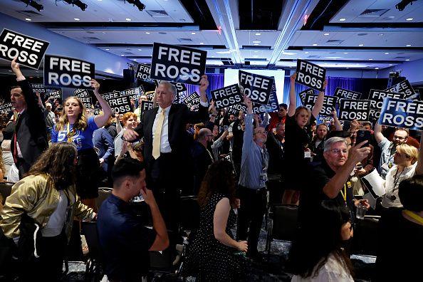  Members of the Libertarian Party stand in chairs at the Libertarian National Convention