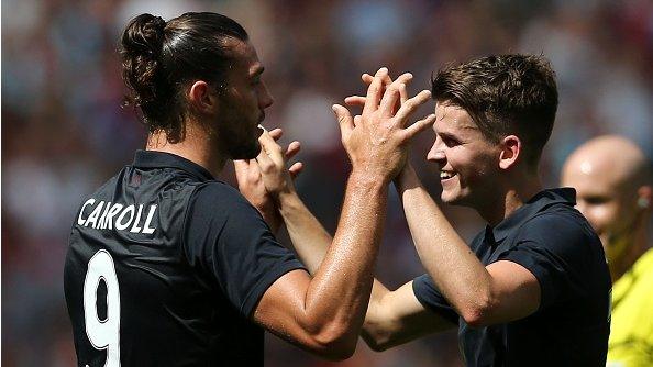 Andy Carroll (left) celebrates scoring against Juventus