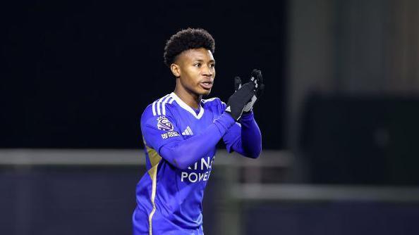 Kian Pennant, playing for Leicester Under-21s, clapping whilst wearing gloves