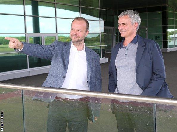 A smiling Jose Mourinho (right) is pictured at Manchester United's training ground with executive vice-chairman Ed Woodward on Sunday