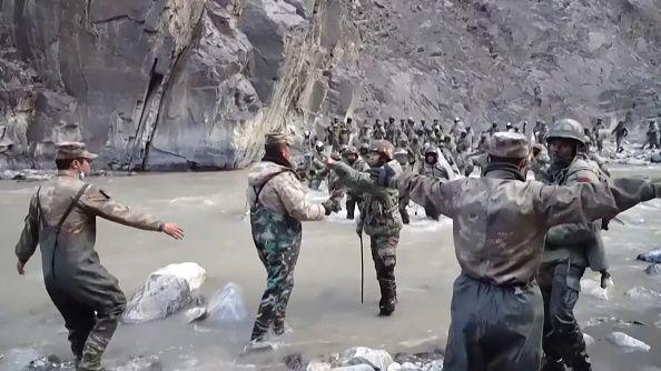 This video frame grab taken from footage recorded in mid-June 2020 and released by China Central Television (CCTV) on February 20, 2021 shows Chinese (foreground) and Indian soldiers (R, background) during an incident where troops from both countries clashed in the Line of Actual Control (LAC) in the Galwan Valley, in the Karakoram Mountains in the Himalayas