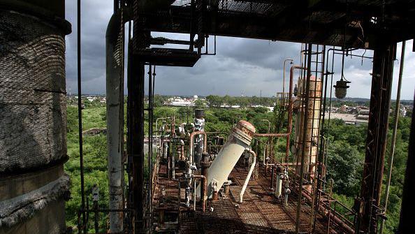 BHOPAL, INDIA - SEPTEMBER 3, 2009: Rusting tanks inside the now derelict Union Carbide factory compound. These tanks used to store methyl isocyanide, the toxic chemical that leaked on December 23, 1984 killing at least 5,000 people in the following 72 hours and many thousands more subsequently. (Photo by Satish Bate/Hindustan Times via Getty Images)
